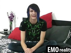 Skinny emo teen with tattoos piercings and dyed hair